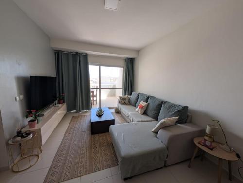 a living room with a couch and a tv at Casa Relaxod in Santa Maria
