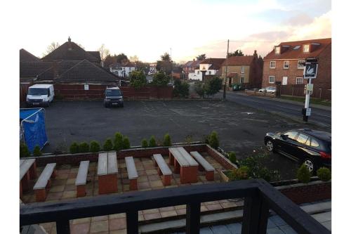 a view of a parking lot with a car parked at Swan Inn, Heathrow Airport in Stanwell