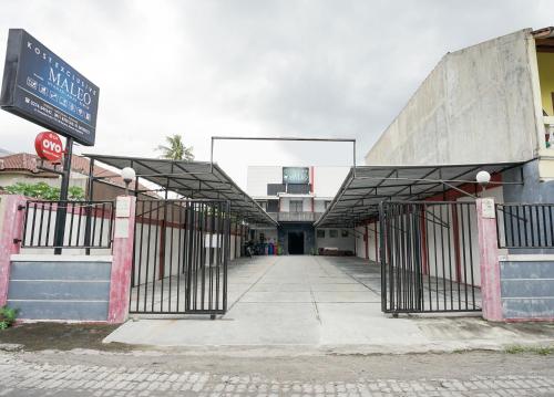an entrance to a building with a gate at Hotel O Seturan Near Hartono Mall Yogyakarta Formerly Maleo Kostel in Yogyakarta