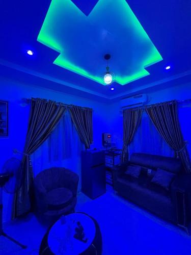 a living room with a green star on the ceiling at Cee&Tee ABK 1BEDROOM -247Electricity - Solar Inverter AC in bedroom in Abeokuta