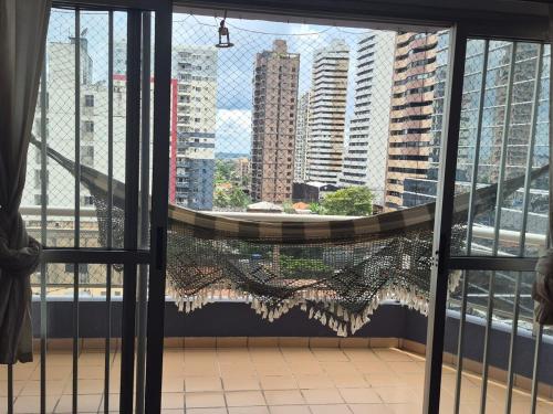 a large window with a view of a city at Apartamento São Brás COP 30 in Belém