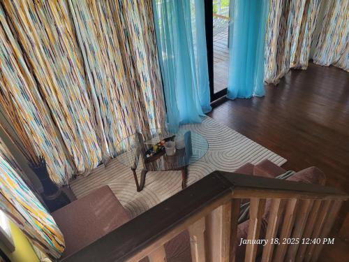 an overhead view of a living room with a couch and a table at Southern Sunset Villa in Choiseul