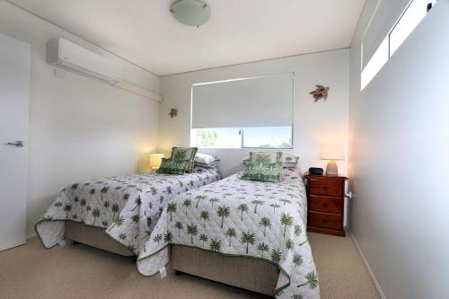 Ένα ή περισσότερα κρεβάτια σε δωμάτιο στο Platinum Apartments Unit 12