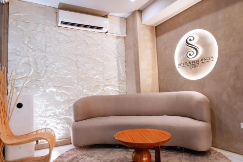 a living room with a couch and a table at S Hotel & Residences in Cebu City