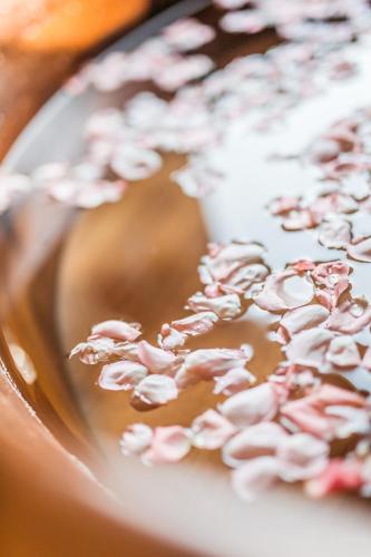 a close up of a chocolate doughnut with pink sprinkles at The Langham, Shanghai, Xintiandi in Shanghai