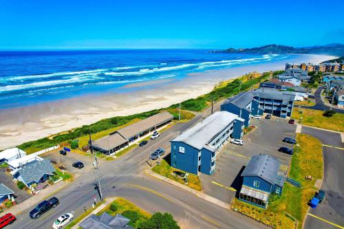 an aerial view of a beach and the ocean at OYO Waves Hotel Newport OR - NYE Beach in Newport