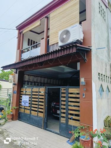 a building with a fan on top of it at Modern Loft House Ormoc in Ormoc