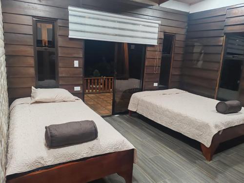 Postel nebo postele na pokoji v ubytování Cabaña Ivi