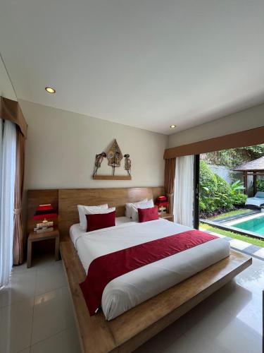 Postel nebo postele na pokoji v ubytování Agata Villas Seminyak