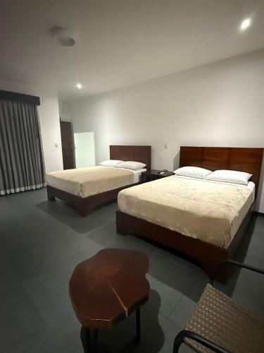 Postel nebo postele na pokoji v ubytování Scala Inn