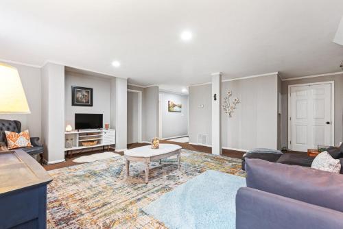 a living room with a couch and a table at Cozy basement apartment in Fayetteville