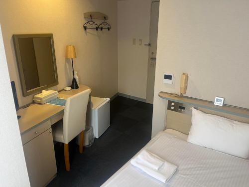Postel nebo postele na pokoji v ubytování Hotel Kokomo