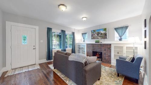 a living room with a couch and a fireplace at Chic Denver Family Retreat Free Parking & Prime Location in Denver