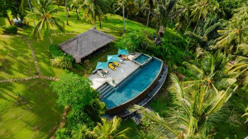 an aerial view of a toy boat on a track at Villa Palem in Tabanan