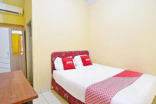 Ένα ή περισσότερα κρεβάτια σε δωμάτιο στο Hotel O A2b Guesthouse