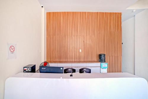 Postel nebo postele na pokoji v ubytování Super OYO 90559 Gamacity Residence
