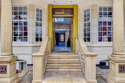 a staircase leading to a building with columns at Empire Hotel in Leicester