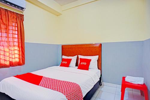 Postel nebo postele na pokoji v ubytování Hotel O Skyview Near Universitas Sumatra Utara ( USU ) Formerly Juma Ciger