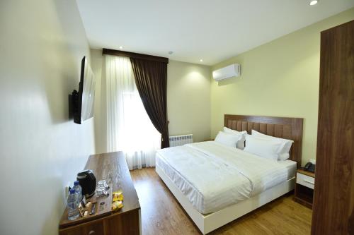 Postel nebo postele na pokoji v ubytování SATO HOTEL TASHKENT