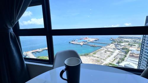 a view of the ocean from an office window at JQ1 SEA & POOL or CITY View WIFI I WASHING MACHINE for Some Units I CUCKOO WATER Jesselton Quay by R2 in Kota Kinabalu