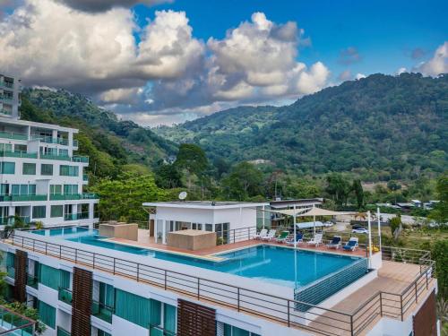 an aerial view of a building with a swimming pool at A New Experience of Private Vacation and Work in Patong in Patong Beach