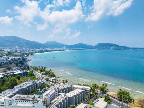 an aerial view of a city and the ocean at A New Experience of Private Vacation and Work in Patong in Patong Beach