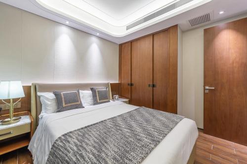 Cama o camas de una habitación en 三亚天成中央海岸海景酒店