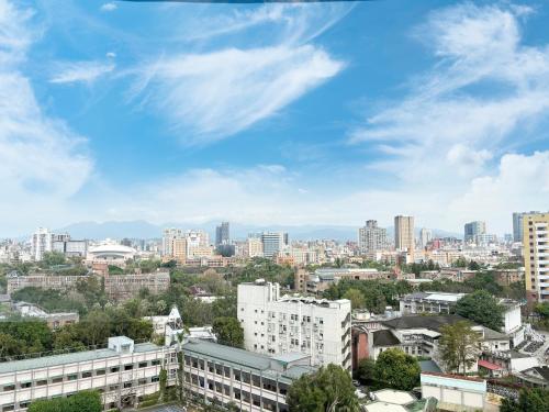 a view of a city skyline with buildings at Just Sleep - Taipei NTU in Taipei
