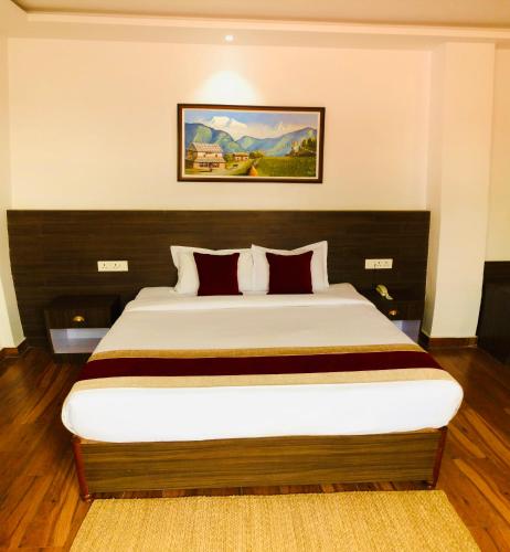 a bedroom with a large bed in a room at Manigram Bishram Batika Pvt Ltd in Bhairahawa