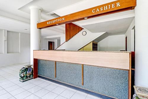 a dressing room with a mirror and a staircase at Collection O Riau Near Trans Studio Bandung Formerly Asteria Hotel in Bandung