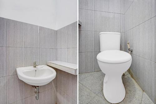 a bathroom with a toilet and a sink at OYO Life 90678 Omah Kulo Guest House in Nganjuk