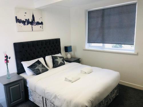 Postel nebo postele na pokoji v ubytování Star Hotel, South Leicester