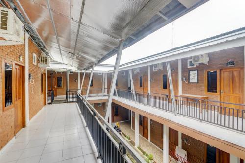 an empty hallway of a school building with a balcony at Hotel O D Kost In Kandri Semarang in Semarang