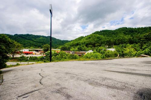 an empty street with a flag on a pole at OYO Hotel Chapmanville Inn, WV - Hwy 119 in Chapmanville