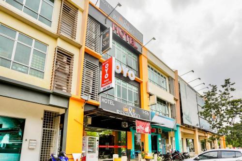 a building with signs on the side of it at Hotel O Kl2f Rest & Go in Shah Alam