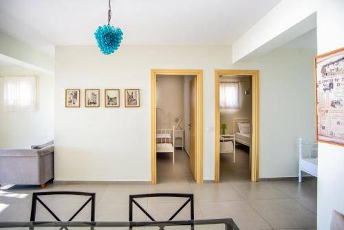 a living room with a couch and a table at The Cerulean Villa - The Concord Of Blue And Green in Mousata