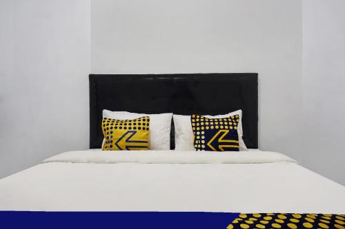 Katil atau katil-katil dalam bilik di Hotel O Wisma Asri Putra Syariah