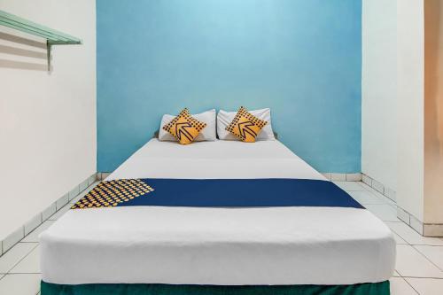 Postel nebo postele na pokoji v ubytování SPOT ON 90964 Hotel Margadana