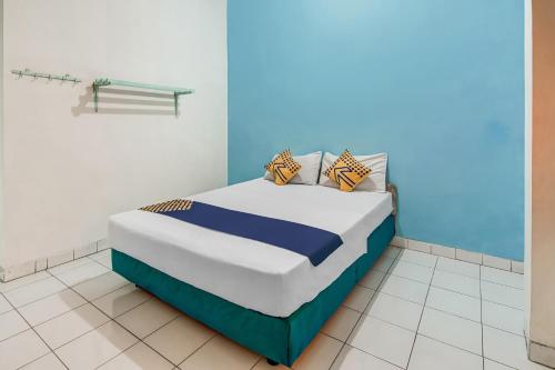 Кровать или кровати в номере Hotel O Margadana