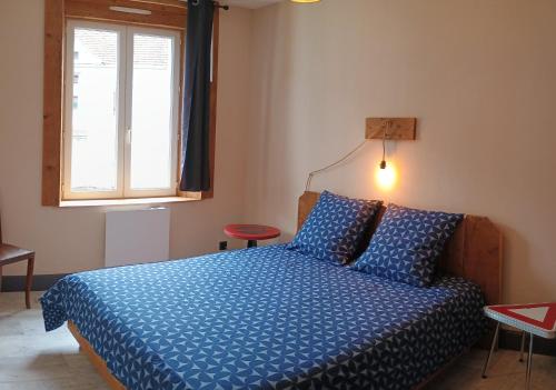 Cama o camas de una habitación en Appartement Le Bihé La Bresse