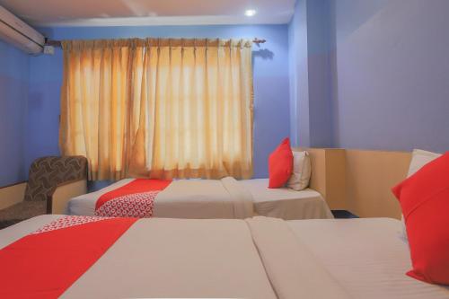 Postel nebo postele na pokoji v ubytování OYO 789 Hotel Shivam Plaza