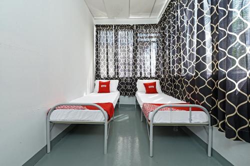 Postel nebo postele na pokoji v ubytování Hotel O Sri Rampai Metro Hostel