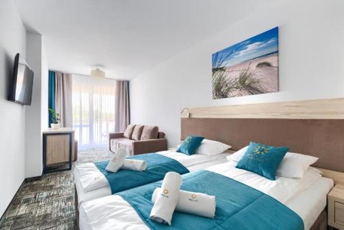 Ένα ή περισσότερα κρεβάτια σε δωμάτιο στο App Standard w Welle