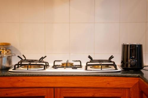 a kitchen counter with two burners on a stove at Khemara Angkor Hotel & Spa in Siem Reap