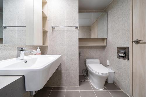 a bathroom with a sink and a toilet at Urbanstay Sokcho Deungdae Beach in Sokcho