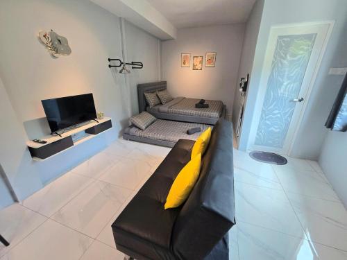 Ένα ή περισσότερα κρεβάτια σε δωμάτιο στο Cozy Retreat Homestay Kuala Terengganu