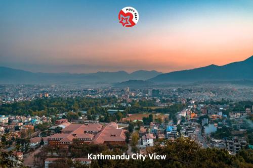 a hot air balloon in the sky over a city at OYO 123 Hotel Prince Plaza in Kathmandu