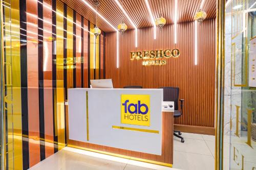 an office with a sign on a desk in a room at Oriva Freshco in Bengaluru