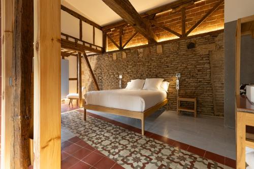 Postel nebo postele na pokoji v ubytování Hotel Boutique Quinta Esencia