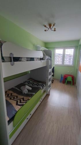 Llit o llits en una habitació de M&M Apartment